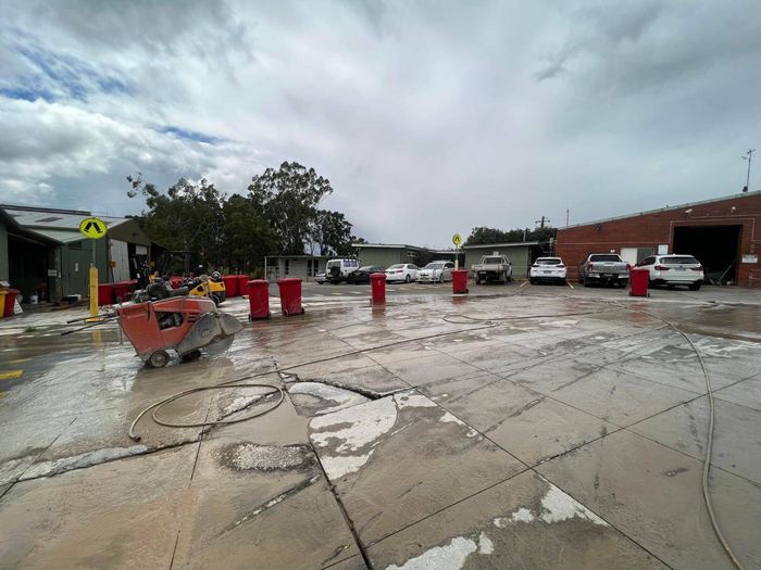 Saw-cut sections in an industrial yard slab